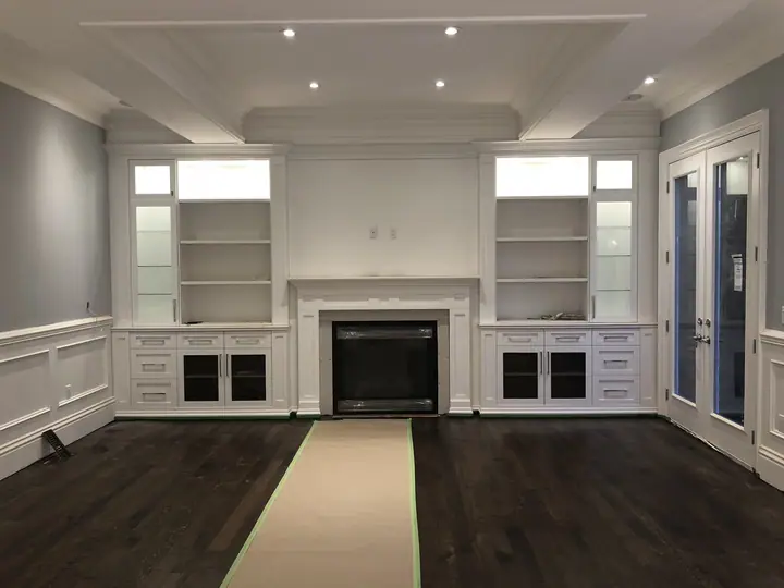 Approximate L4C-area renovation photo showing a fireplace wall with built-in cabinetry